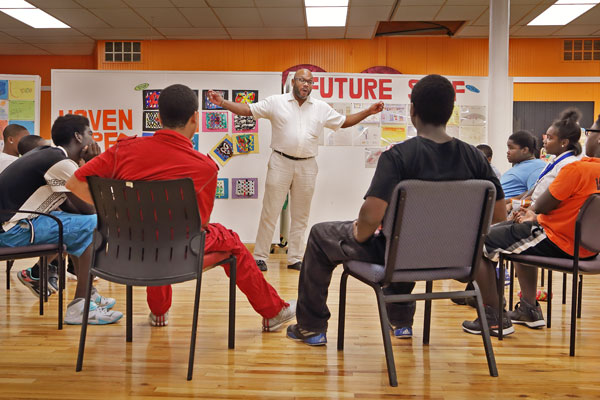 Frank McGhee, director of NSO YIP, mentoring a group of young Detroit men